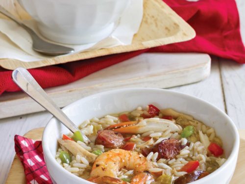 Conecuh sausage and seafood gumbo in a white bowl