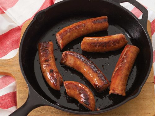 Conecuh Sausage sizzling in Cast Iron Pan