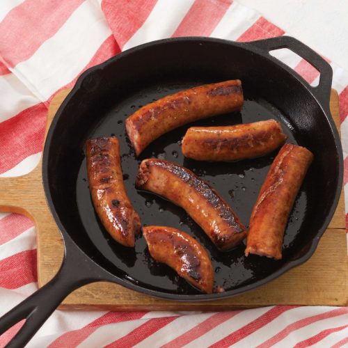 Conecuh Sausage sizzling in Cast Iron Pan